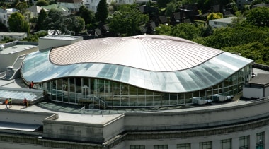 A view of the copper roof installed on architecture, arena, building, corporate headquarters, daylighting, daytime, landmark, metropolitan area, roof, sport venue, stadium, structure, black
