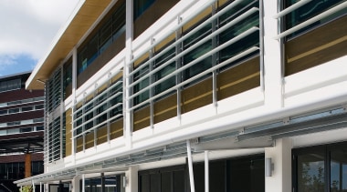 A view of extensive use of elliptical louvres architecture, building, commercial building, corporate headquarters, facade, mixed use, real estate, window, white