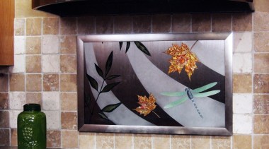 A view of this modern kitchen designed by countertop, gray, black