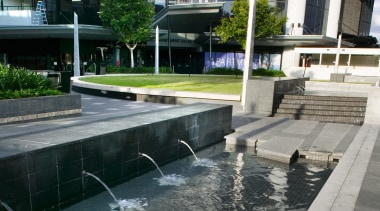 A view of the outdoor water feature at architecture, building, condominium, reflecting pool, reflection, residential area, swimming pool, urban design, water, water feature, gray, black