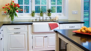A view of this kitchen featuring white timber cabinetry, countertop, cuisine classique, floor, flooring, hardwood, home, interior design, kitchen, room, window, wood flooring, gray