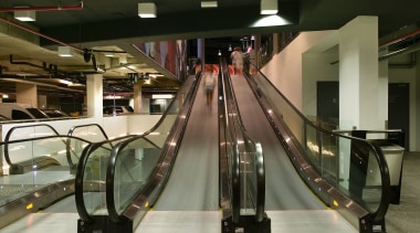 A view of the four moving escalator walkways escalator, brown, black