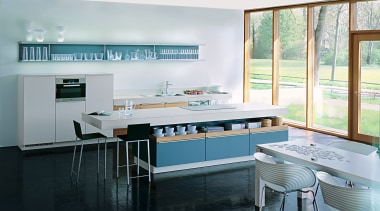 A view of a kitchen by Poggenphol Kitchens. countertop, interior design, kitchen, room, table, window, white, black