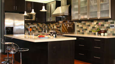 View of this kitchen featuring stained timber flooring, cabinetry, countertop, cuisine classique, interior design, kitchen, room, black, brown