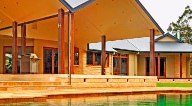 A view of some stone pavers treated with architecture, estate, facade, home, house, leisure, leisure centre, property, real estate, swimming pool, villa, wood, white, orange