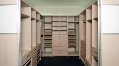 A view of the Walk in wardrobe featuring cabinetry, closet, cupboard, furniture, wardrobe, white