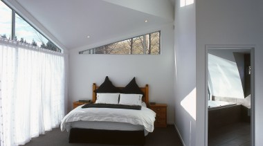 The architect of this rural retreat designed the architecture, bed frame, bedroom, ceiling, daylighting, floor, home, interior design, property, real estate, room, window, gray, black