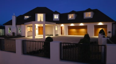 A view of this home hiding the facade architecture, building, elevation, estate, facade, home, house, lighting, property, real estate, residential area, window, black, blue