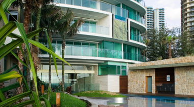 A view of the sandstone stepping stones, sandstone apartment, architecture, arecales, building, condominium, estate, hotel, mixed use, palm tree, property, real estate, reflection, residential area, resort, swimming pool, water, gray