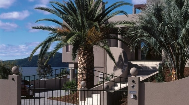 A view of this new lake front house architecture, arecales, estate, fence, home, outdoor structure, palm tree, plant, property, real estate, residential area, sky, tree, wall, black, gray