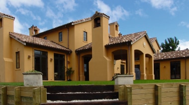 A view of roof tiles from Solerati. - building, elevation, estate, facade, home, house, mansion, neighbourhood, property, real estate, residential area, villa, brown, teal