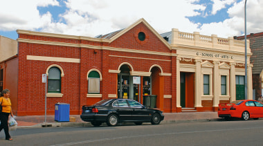 A view of an exterior restoration carried out architecture, building, car, city, downtown, facade, family car, house, landmark, metropolitan area, neighbourhood, property, real estate, residential area, sky, town, vehicle