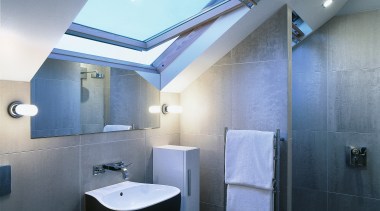 Tiled surfaces create a clean, modern look. - architecture, bathroom, ceiling, daylighting, interior design, lighting, product design, room, teal