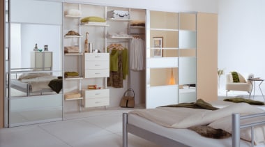 A view of the wardobe storage system in bed frame, furniture, interior design, gray, white