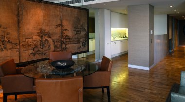 A view of the living area in this ceiling, floor, flooring, interior design, living room, lobby, room, wall, wood flooring, brown, gray