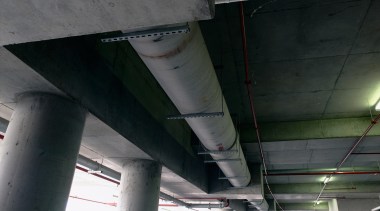 A view of the hydraulic system that incorporates aerospace engineering, airplane, architecture, aviation, beam, ceiling, pipe, steel, structure, black, gray