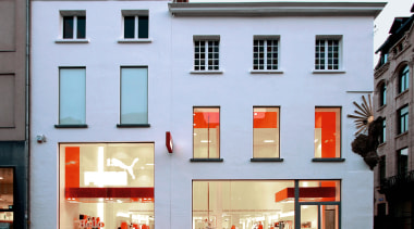 An exterior viow of the puma shopfront,  architecture, building, facade, house, window, teal