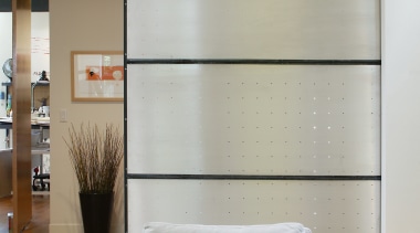 An interior view of the living area featuring ceiling, floor, furniture, interior design, living room, room, wall, window, gray