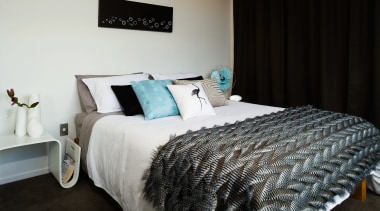 A view of this modern retro bedroom designed bed, bed frame, bed sheet, bedding, bedroom, duvet cover, home, interior design, mattress, room, textile, black, white