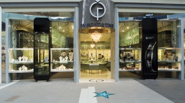 An exterior view of the Diamong &amp; Time boutique, display window, retail, gray