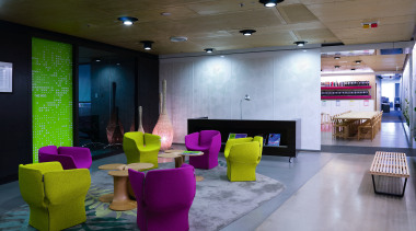 A view of this office breakout area featuring architecture, ceiling, interior design, lobby, table, gray