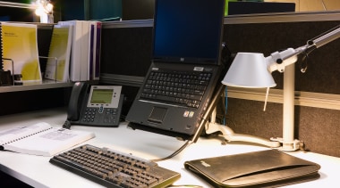 A view of this desk featuring laptop, phone, desktop computer, electronic device, furniture, laptop, netbook, personal computer, product, product design, technology, black