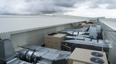A view of an air conditioning unit from architecture, roof, water, gray