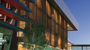 An exterior view of the Restaurants &amp; shops architecture, building, commercial building, condominium, convention center, corporate headquarters, facade, headquarters, hotel, metropolitan area, mixed use, real estate, reflection, residential area, sky, structure, blue, green