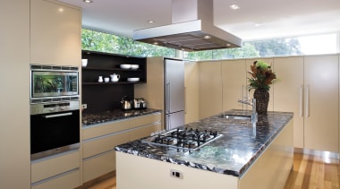 A view of this kitchen featuring polished timber countertop, interior design, kitchen, real estate, room, gray