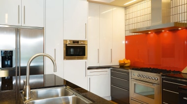 A view of this kitchen featuring kauri flooring, cabinetry, countertop, cuisine classique, home appliance, interior design, kitchen, real estate, room, white