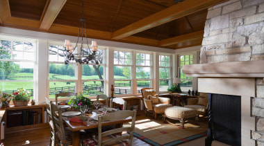 The kitchen and ajacent porch have a relaxed, home, interior design, living room, real estate, room, window, brown, gray