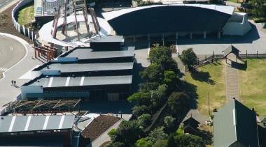 An aerial view of the roffing on the aerial photography, architecture, city, property, real estate, residential area, roof, sport venue, structure, suburb, black, gray