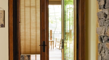 A view of this house featuring Pella timbers door, hardwood, home, interior design, real estate, window, window covering, window treatment, wood, brown