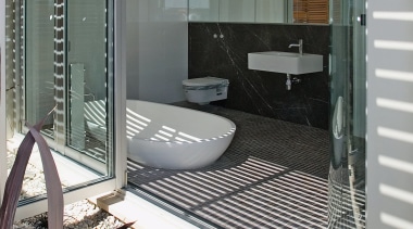 A view of some kitchen and bathroom cabinetry architecture, door, facade, glass, house, real estate, window, gray