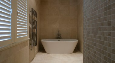 A view of the NKBA Award wining bathroom bathroom, floor, flooring, interior design, plumbing fixture, property, real estate, room, tile, wall, brown, gray