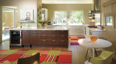 A new wing is fully glazed along one cabinetry, countertop, cuisine classique, floor, flooring, interior design, kitchen, living room, room, table, brown