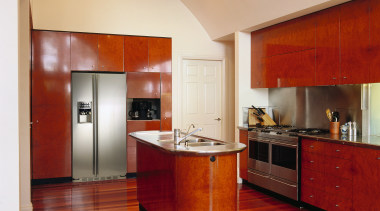 A view of this GE side by side architecture, cabinetry, ceiling, countertop, floor, flooring, hardwood, interior design, kitchen, laminate flooring, real estate, room, wood, wood flooring, red