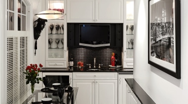 A view of this kitchen featuring black and countertop, floor, flooring, interior design, kitchen, room, gray