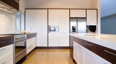A view of this kitchen featuring laminex caeserstone cabinetry, countertop, cuisine classique, home appliance, interior design, kitchen, real estate, room, gray