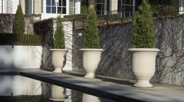 A view of lightwiehg t glass fibred reinforced outdoor structure, plant, tree, window, black, gray