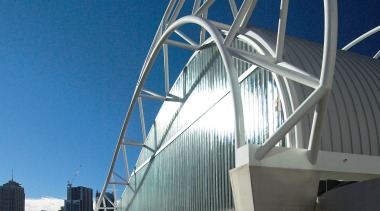 An exterior view of the ian thorpe aqautic arch bridge, architecture, bridge, building, fixed link, landmark, structure, tied arch bridge, blue