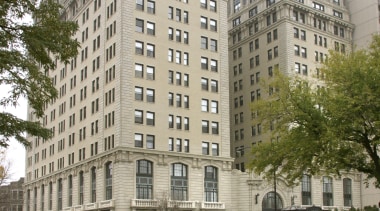 A view of the custom cherry timber cabintry apartment, architecture, building, city, condominium, corporate headquarters, daytime, downtown, estate, landmark, metropolis, metropolitan area, mixed use, neighbourhood, plaza, real estate, residential area, skyscraper, suburb, tower block, tree, urban area, white, brown