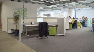 A view of this commercial office aspace featuring floor, flooring, office, gray