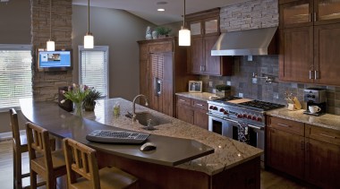 A view of a kitchen designed by Drury cabinetry, countertop, cuisine classique, interior design, kitchen, real estate, room, brown, gray