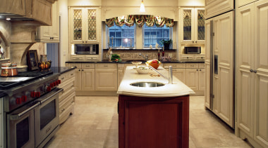 A view of a kitchen designed by Insignia cabinetry, countertop, cuisine classique, floor, flooring, hardwood, interior design, kitchen, room, wood flooring, orange, brown