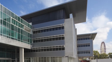 An exterior view of the greensquare building. The architecture, building, commercial building, condominium, corporate headquarters, daytime, elevation, facade, headquarters, metropolitan area, mixed use, real estate, sky, gray, teal