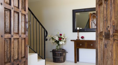 The modern, European rustic look is reinforced by door, estate, floor, flooring, furniture, home, interior design, property, real estate, room, wood, brown, gray