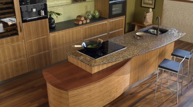 A view of this ktichen featuring a Vetrazzo cabinetry, countertop, floor, flooring, furniture, hardwood, interior design, kitchen, table, wood, wood flooring, wood stain, brown