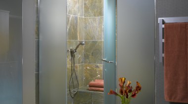 A view of this bathroom featuring a pearwood bathroom, glass, interior design, plumbing fixture, room, window, gray