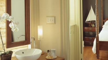 A view of this bathroom featuring polished timber bathroom, floor, flooring, hardwood, home, interior design, laminate flooring, real estate, room, sink, suite, wall, window, wood, wood flooring, brown